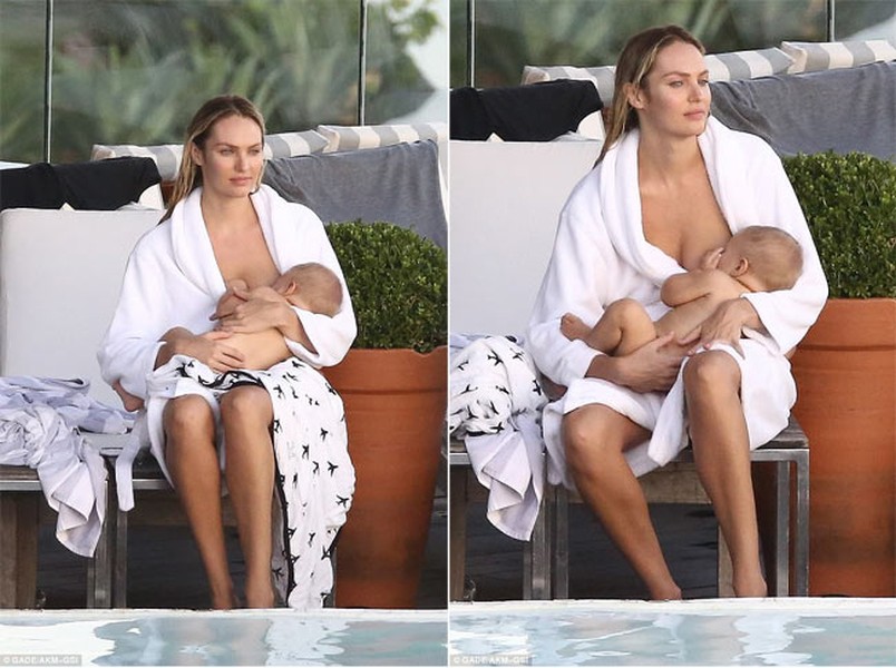 Mới đây, người mẫu Candice Swanepoel đã có buổi chụp mẫu ảnh cùng con trai 5 tháng tuổi Anaca. Vì cho con bú mẹ, nên thỉnh thoảng  thiên thần Victoria’s Secret lại phải giải lao để cho con ti. (Ảnh: AKM-GSI)